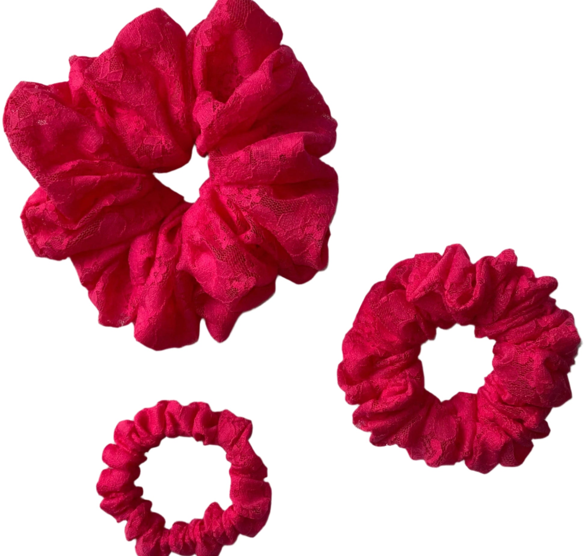 Three pink lace hair scrunchies of varying sizes displayed on a white background.