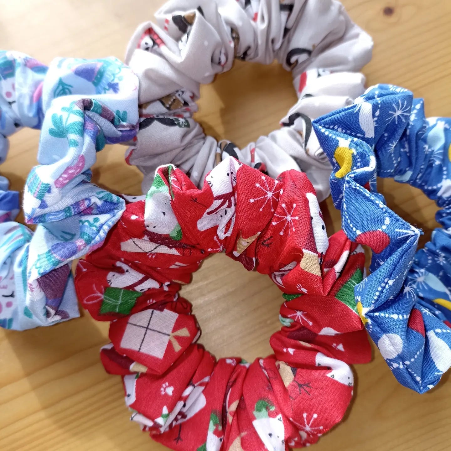 Christmas pack of four hair scrunchies. Made with strong elastic to give the perfect hold on your hair.