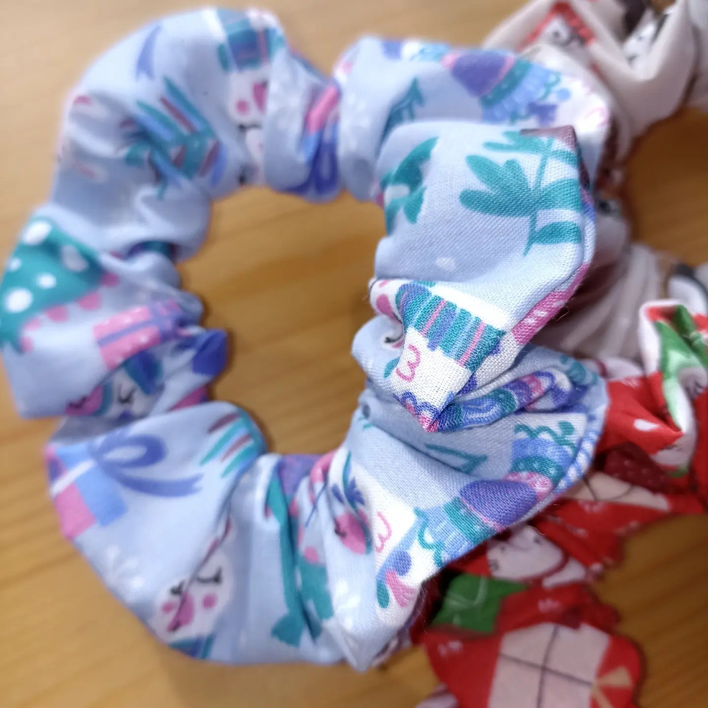 Christmas pack of four hair scrunchies. Made with strong elastic to give the perfect hold on your hair.