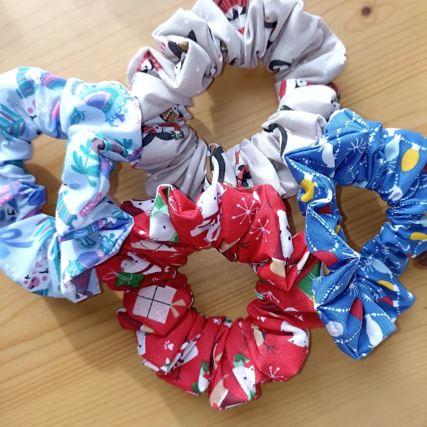 Christmas pack of four hair scrunchies. Made with strong elastic to give the perfect hold on your hair.