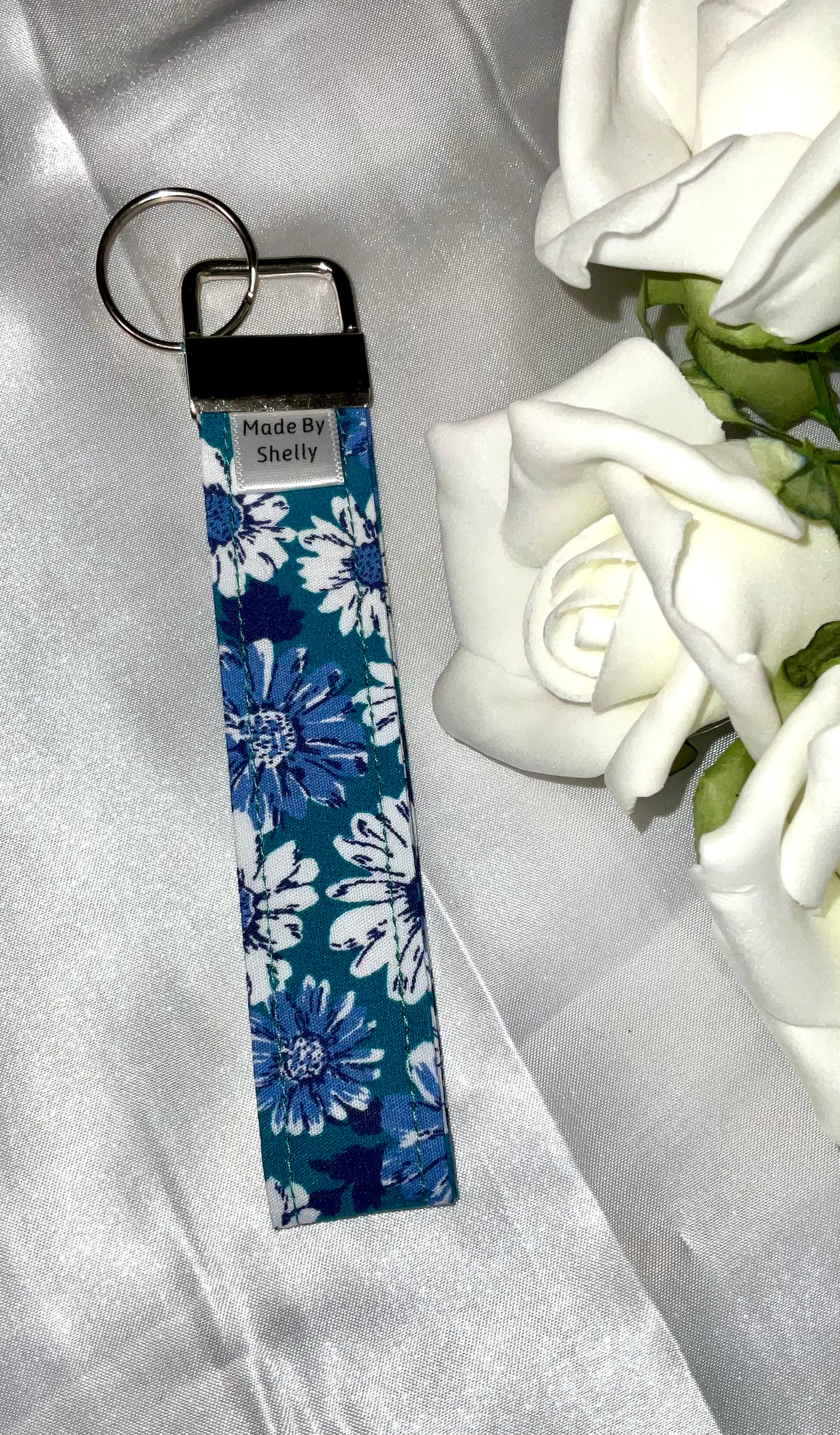 Daisy Wristlets With A Silver Tone Hardware